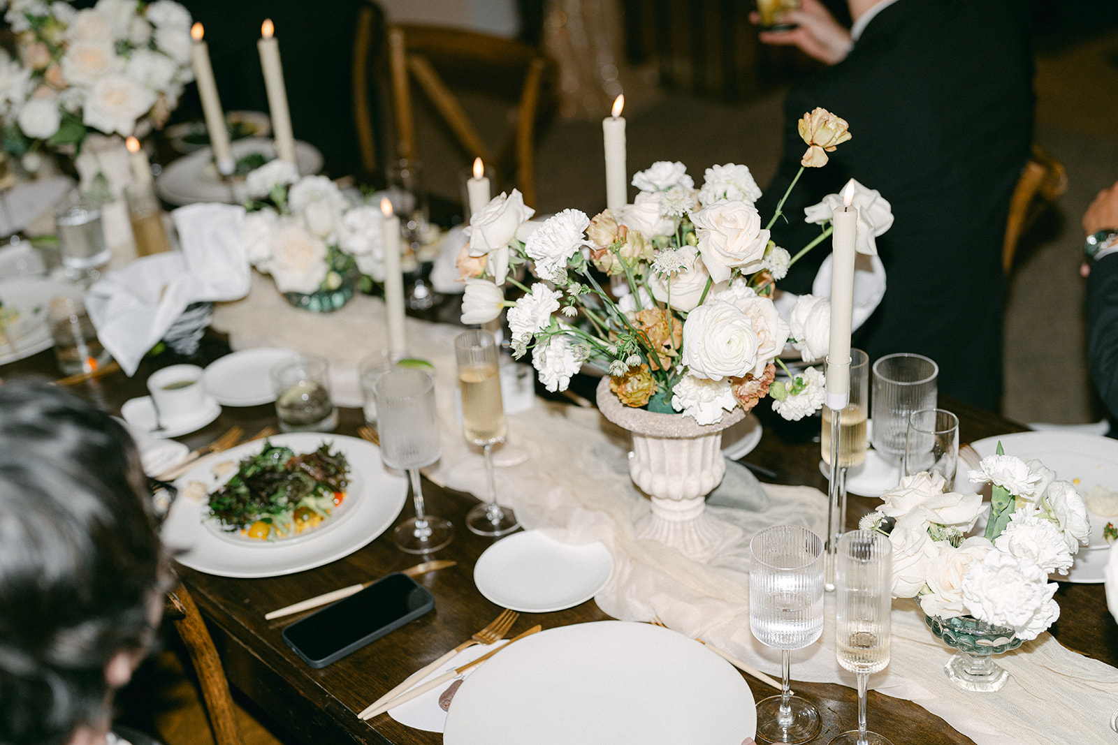 Platted Dinner with White Florals and Candles at Wedding Dinner Reception