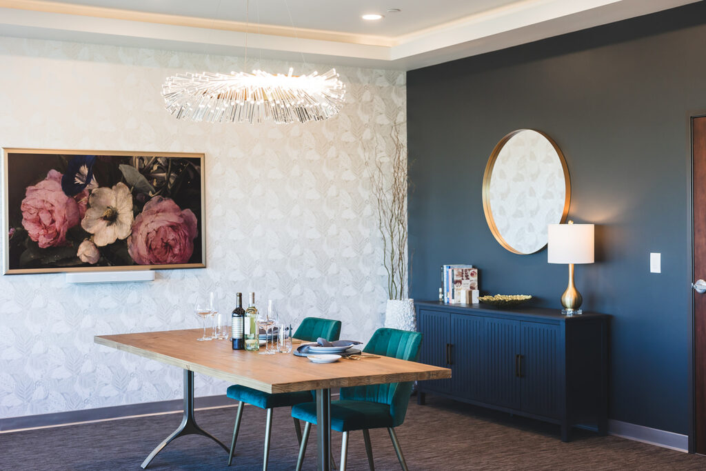 Tasting room set for two with two wine bottles on the table at the MBM Hospitality offices in Torrance