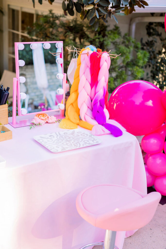 Mirror and pink tablecloth for a braid bar for a My Little Pony kid's party 