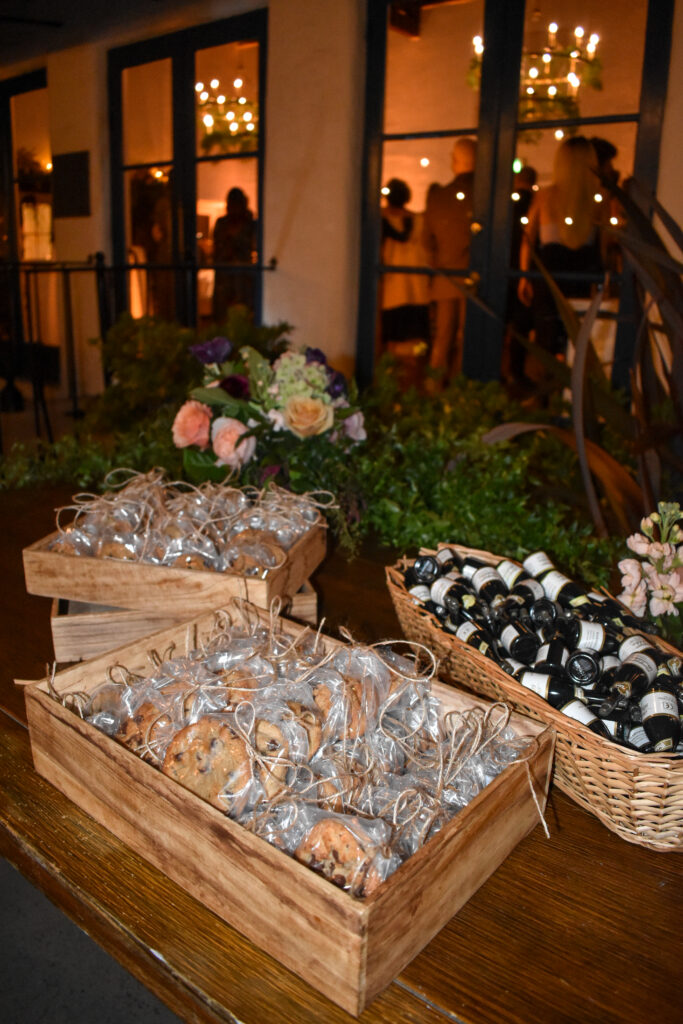 Meg’s Famous Chocolate Chip Cookies individually wrapped and tied with string on the thank you table near the exit of a wedding at La Venta Inn 