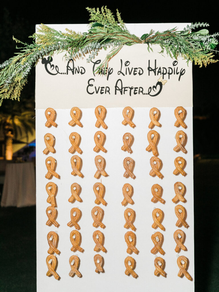 Churro wall with the text And They Lived Happily Ever After at a Disney themed wedding 