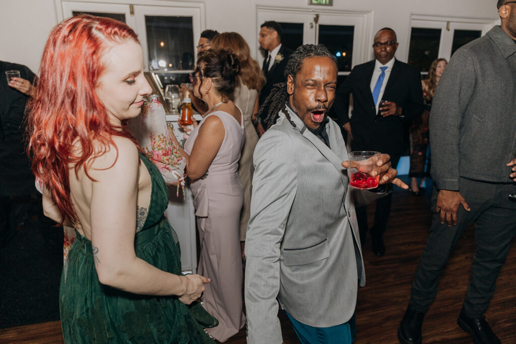 Group Dancing with Cocktails and Beers at La Venta Inn Wedding