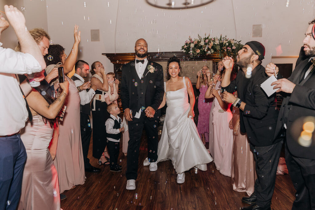 Wedding Grand Exit for Bride and Groom with Bubbles Being Blown By Guests