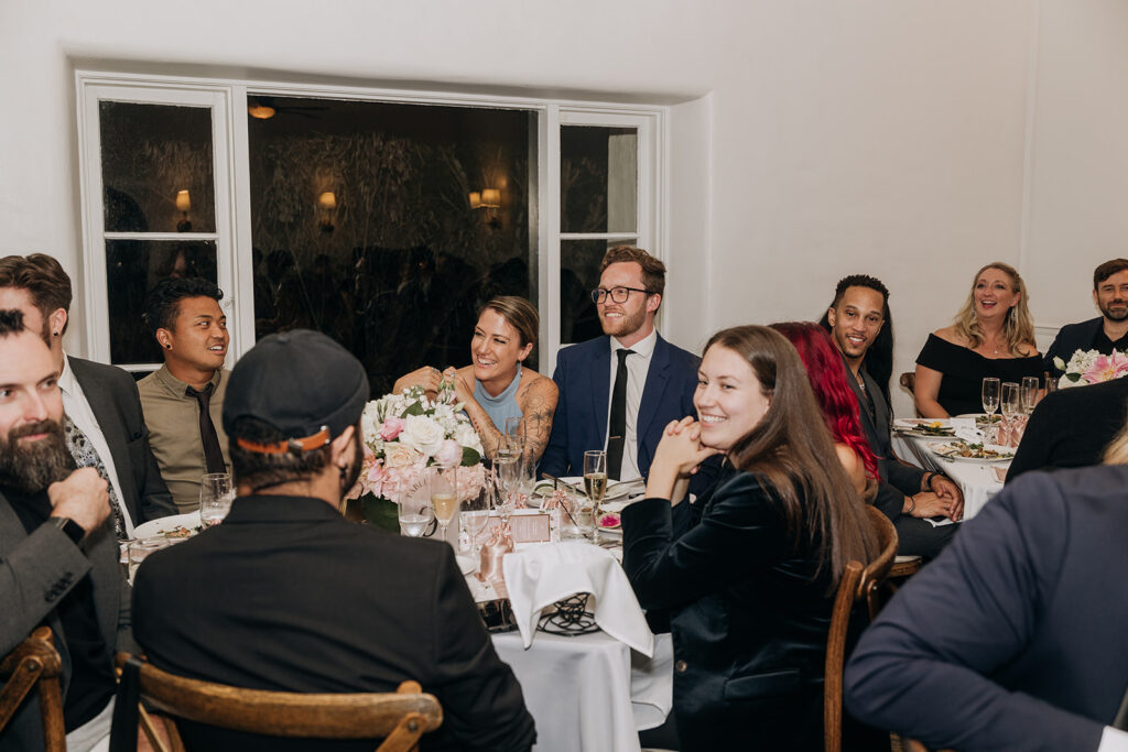 Guests Seated at Round Tables in Garden Dining Room at La Venta Inn at Night