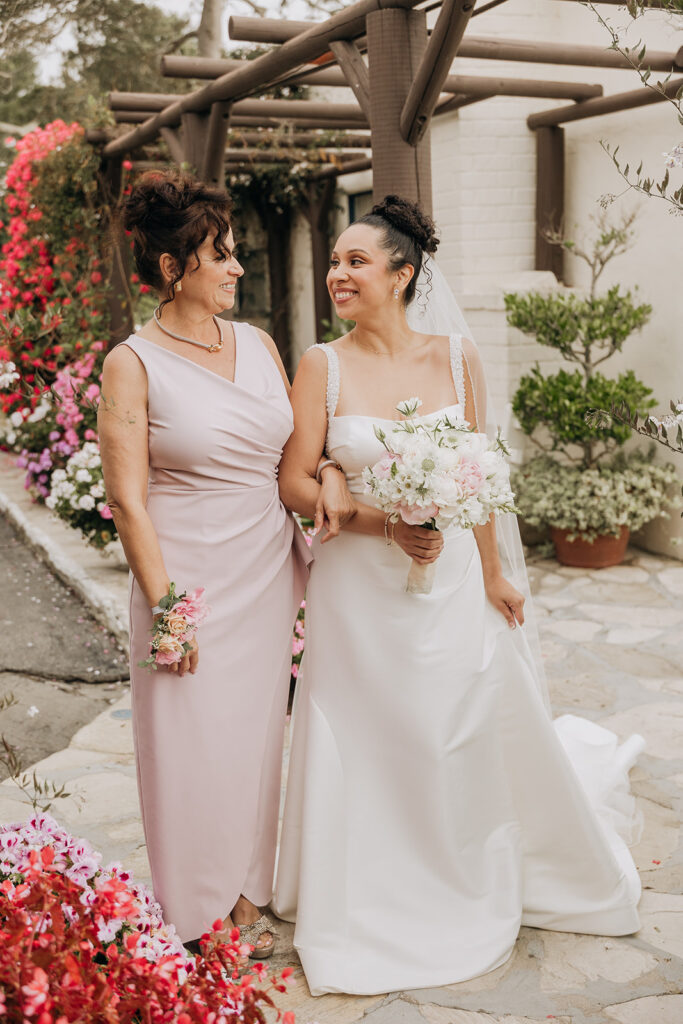 Bride and Mother of the Bride at La Venta Inn in front of Oceanview Cottage