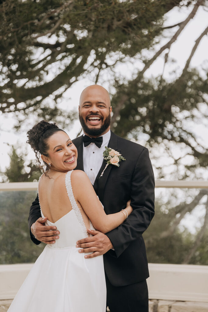 Couple Smiles and Embraces After First Look Before Wedding Ceremony at La Venta Inn