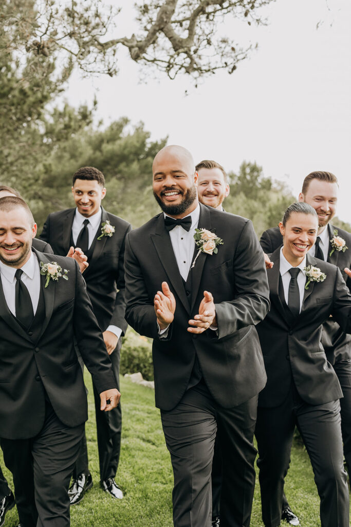 Wedding Party walking with Groom on Grass Lawn Pre-Ceremony