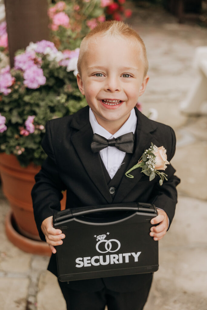 Ring Security serves as the modern Ring Bearer 2.0 Holding Black Case with Wedding Rings