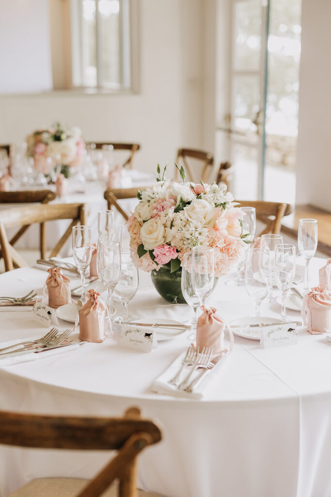 La Venta Inn Wedding Table Setting With Blush Accents and Candles in Pink Bags