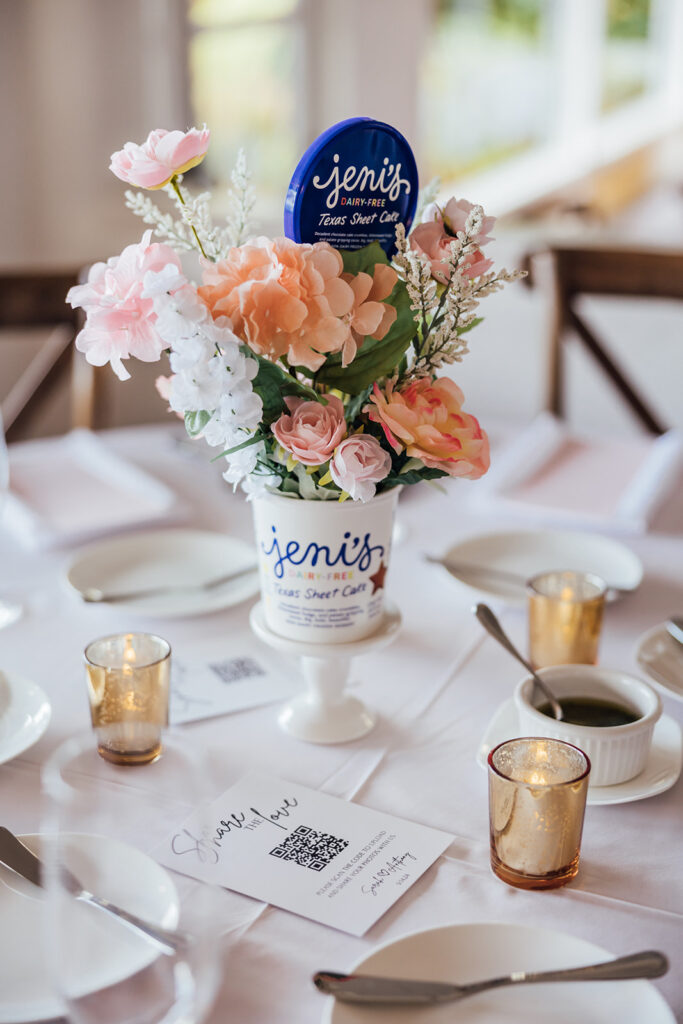 A candid shot of a flroal center piece that is ice cream themed. The floral arrangement is inside an ice cream cup.